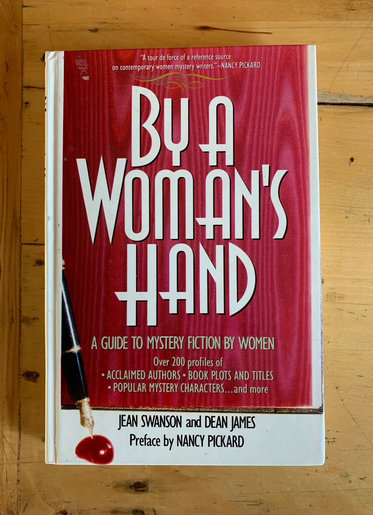 By a Woman's Hand: A Guide to Mystery Fiction by Women by Jean Swanson and Dean James